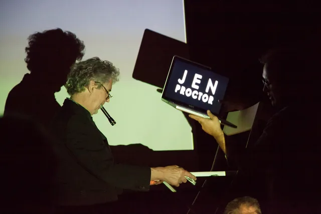 An original film from Bruce Conner made 50 years ago on the big screen, with a recent remake by Jen Proctor playing on the laptop. Fictional case: the review used the wrong screener